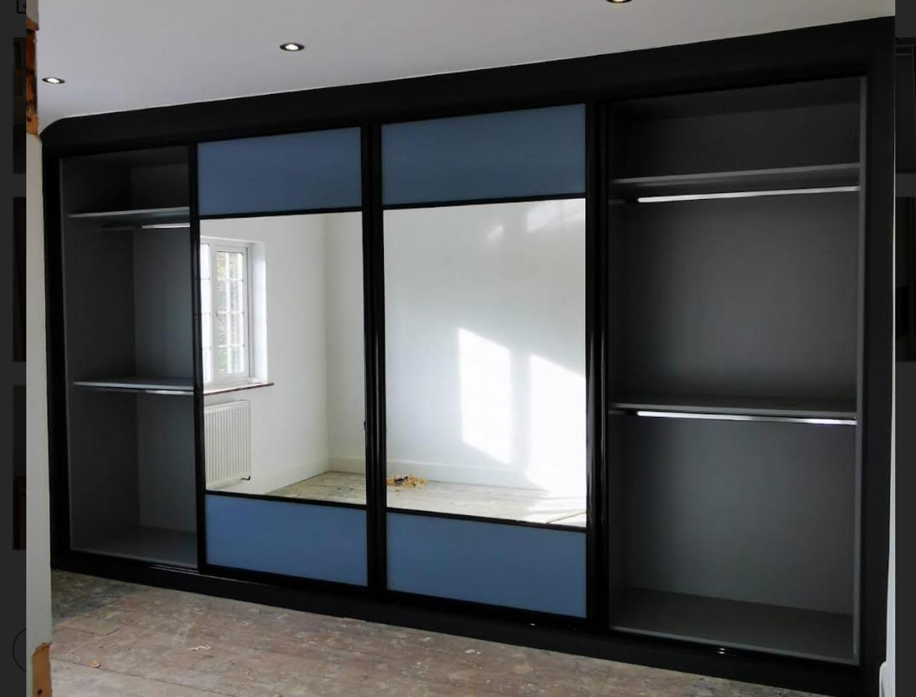 Sliding door wardrobe with silver mirror by Beautiful bedrooms London